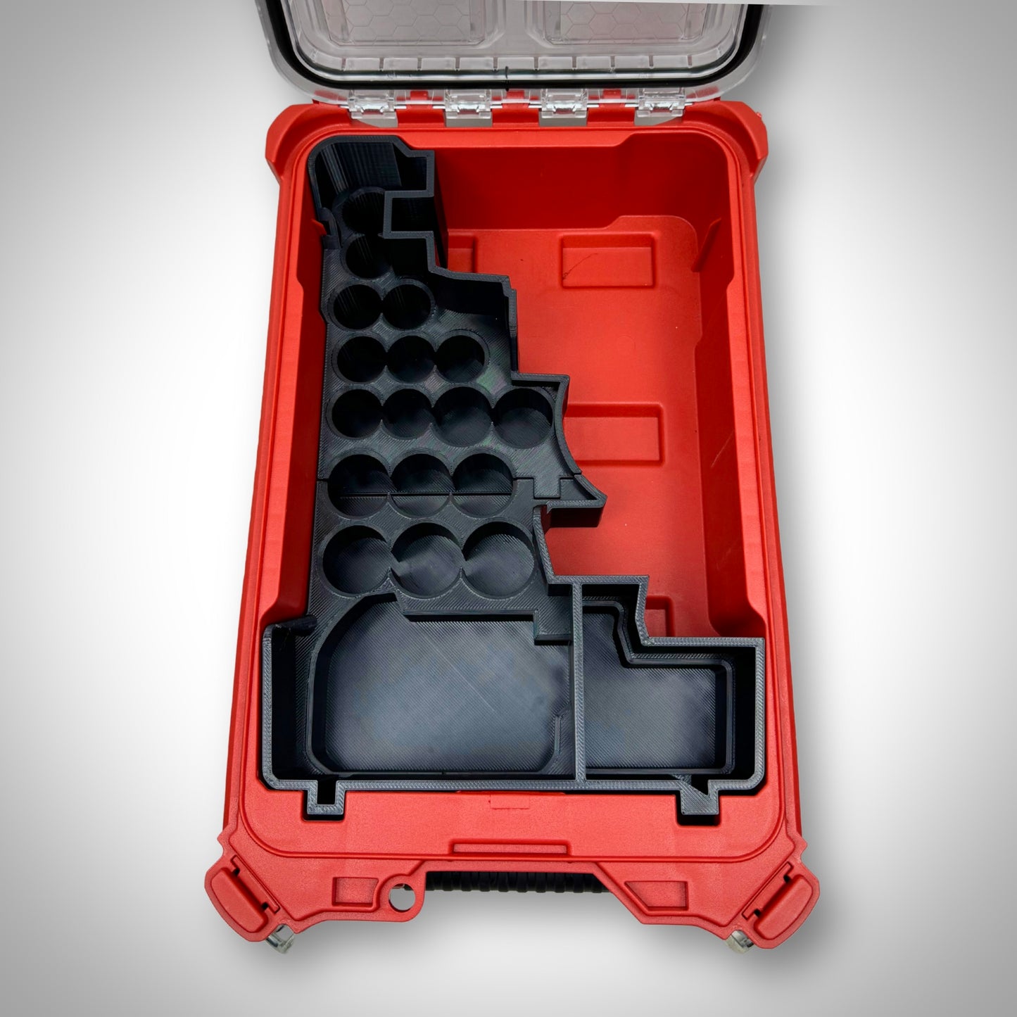 Empty custom insert for M18 1/2" Impact Wrench and sockets resting inside the PACKOUT™ Compact Organiser, highlighting precise cutouts.