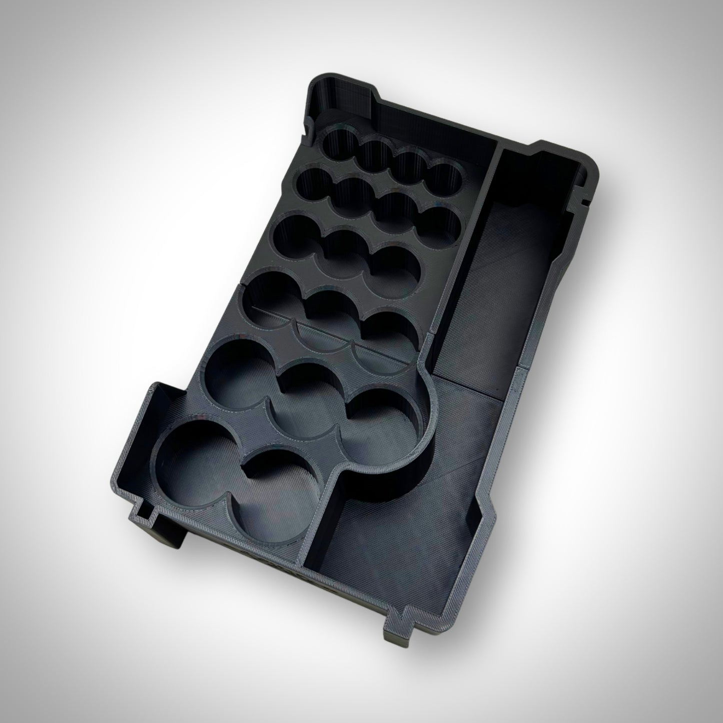 Empty SAE socket organiser insert displayed outside the Milwaukee PACKOUT Toolbox, showing precise socket grid layout and durable construction