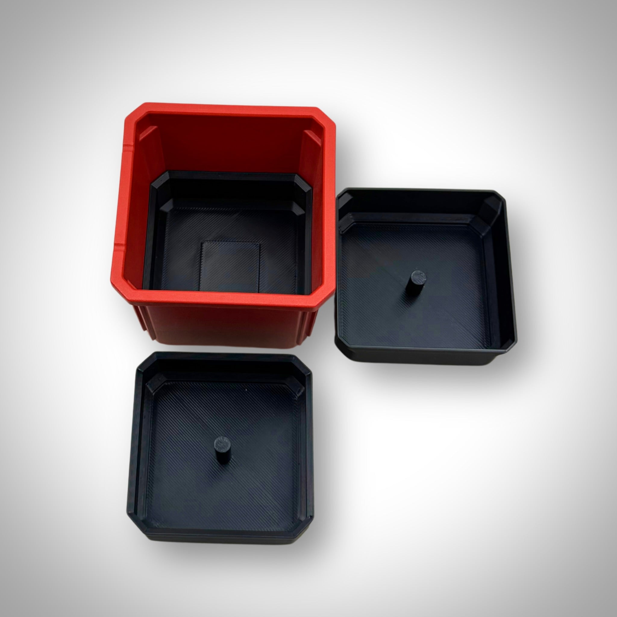 Empty triple stack bin dividers fitted inside the Milwaukee PACKOUT™ Medium Organiser, showing the modular compartments for small parts storage