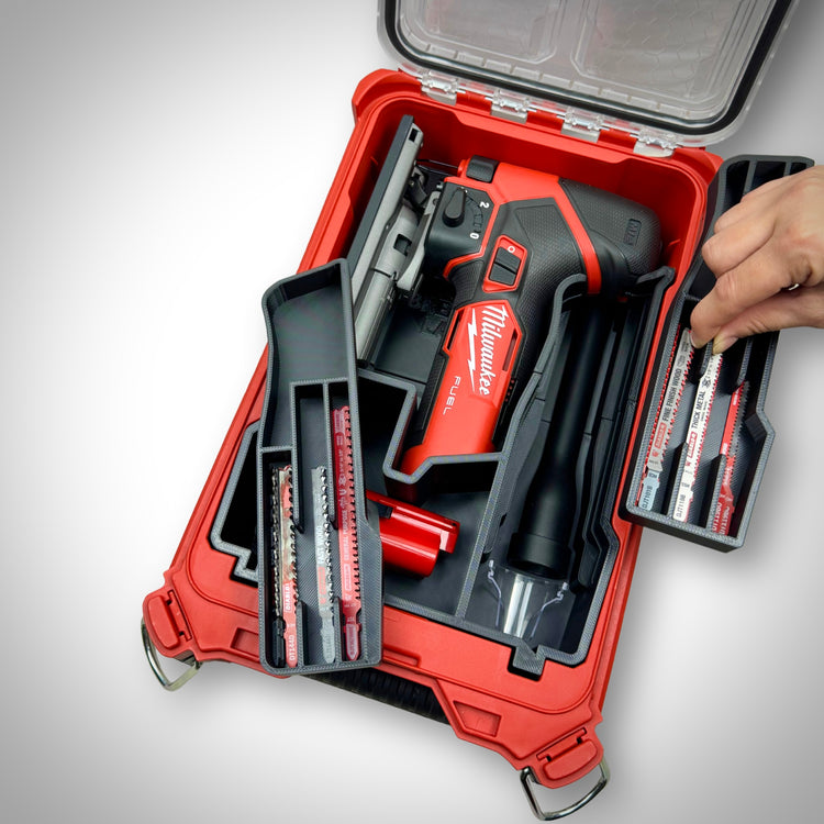 Milwaukee PACKOUT Compact Organiser with custom insert securely holding the M12 FUEL Jigsaw and accessories all neatly arranged inside the container with the removable compartments being showcased.