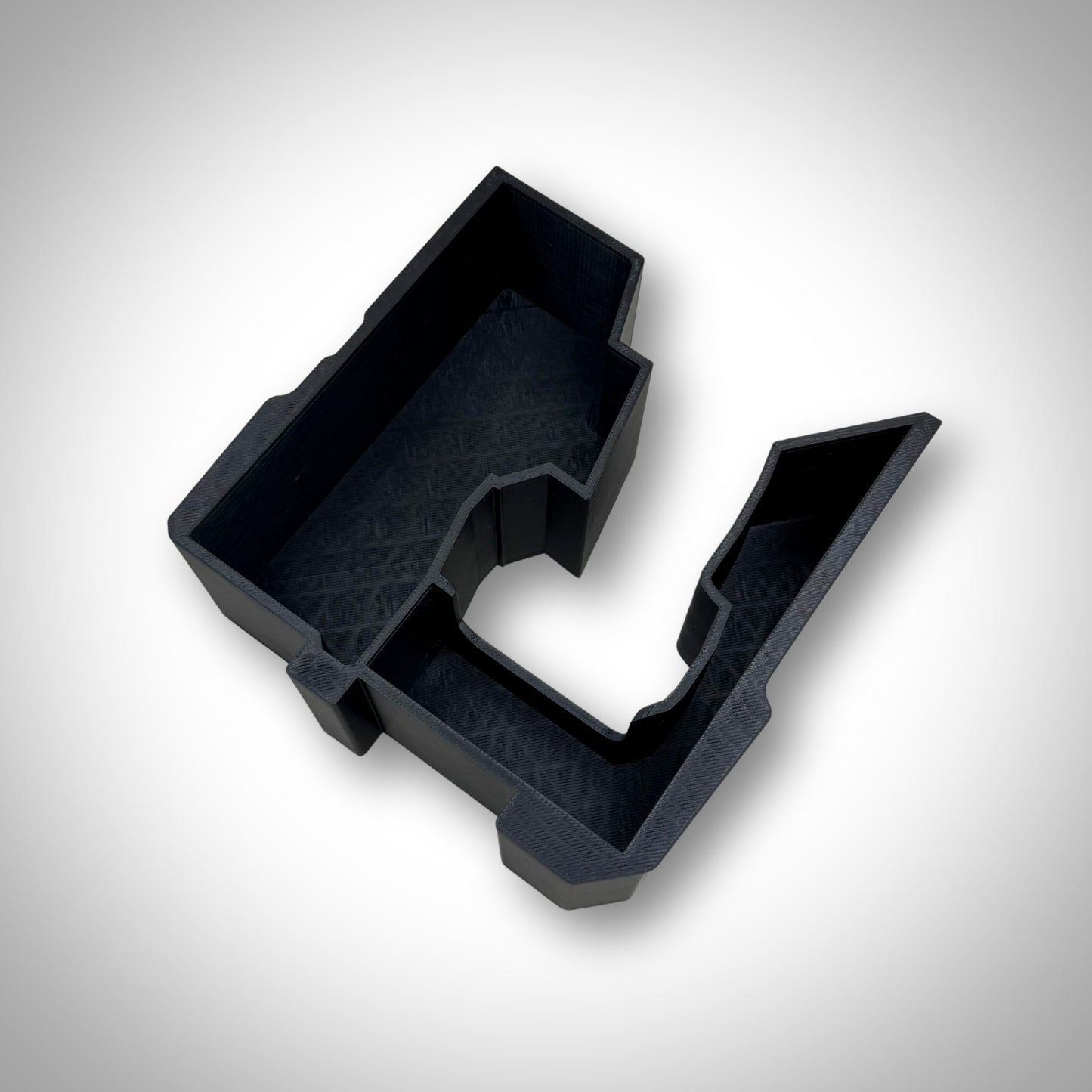 Custom insert outside the PACKOUT™ box, clearly showing slots designed for an impact wrench, M18 batteries, and accessories.