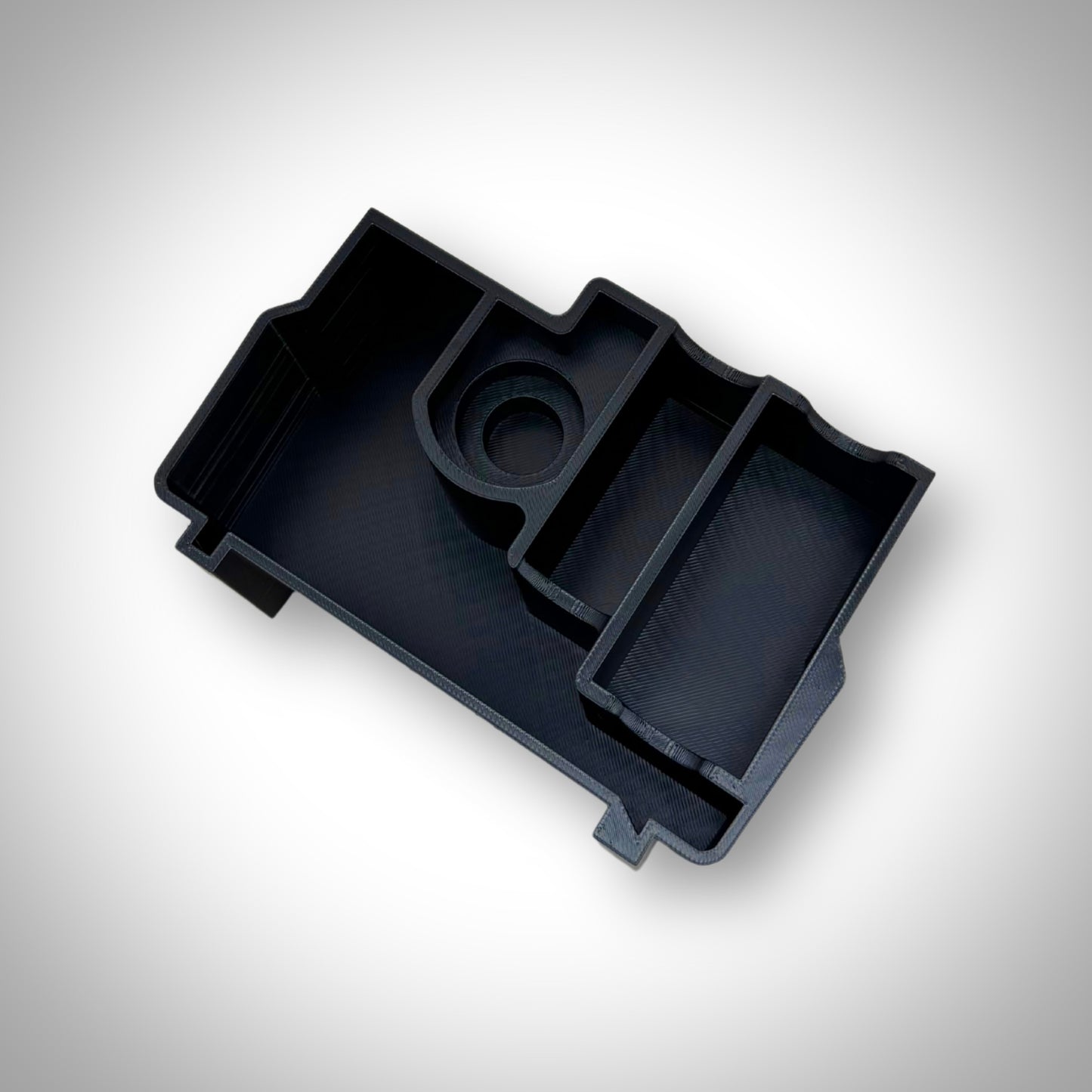 Charging Kit Insert removed from the PACKOUT™ Compact Organiser, shown empty with clearly molded battery and charger slots.