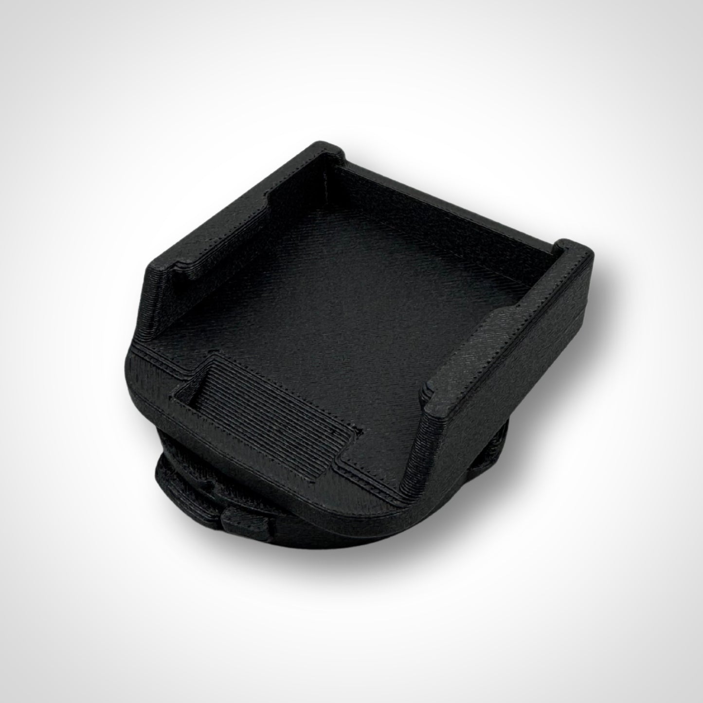 Makita 18V battery adaptor insert shown outside the PACKOUT™, highlighting rugged construction and precise battery fit.