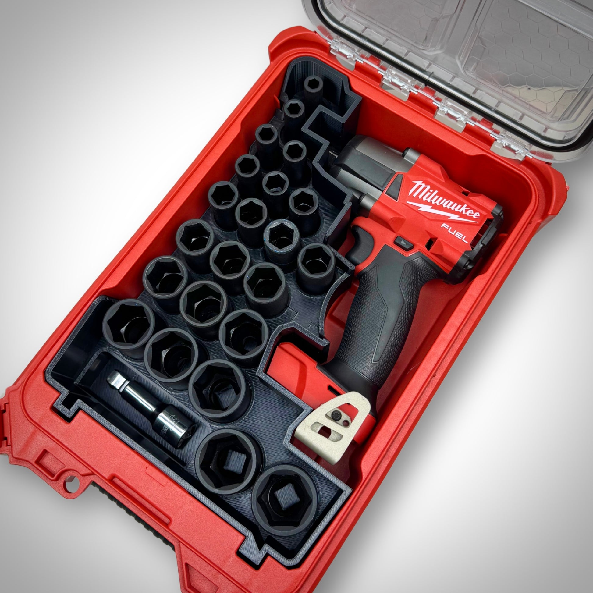 M18 1/2" Impact Wrench and full socket kit neatly arranged in the custom insert inside the Milwaukee PACKOUT™ Compact Organiser.