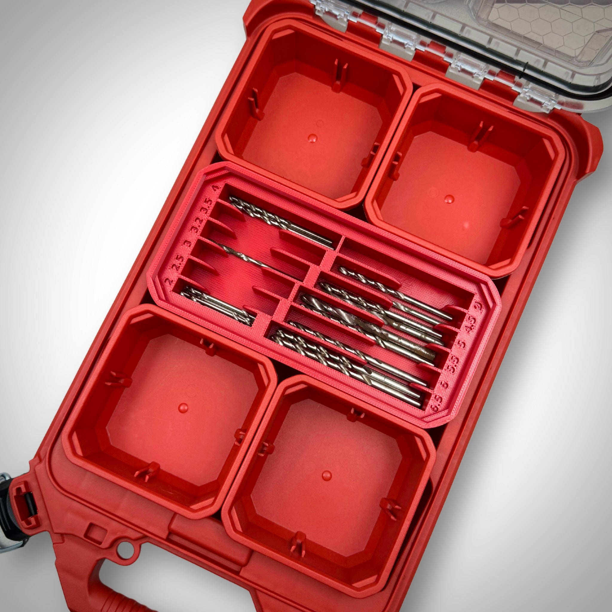 Milwaukee PACKOUT™ Low Profile Organiser with red Metric Drill Bit Holder Insert fully loaded with assorted metric drill bits, neatly organised inside the toolbox.