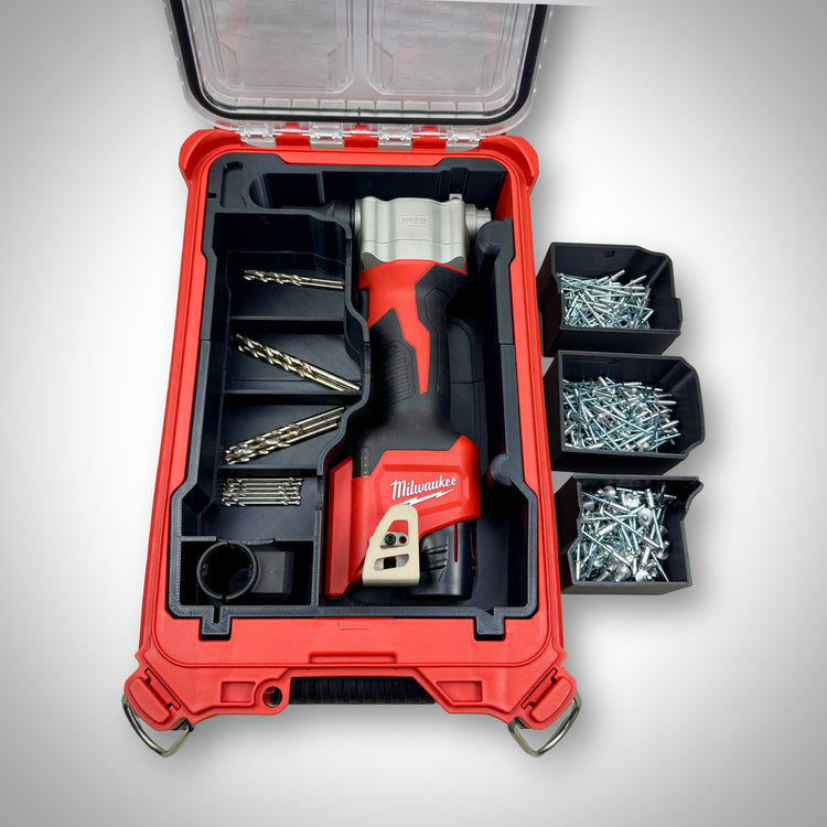 Milwaukee PACKOUT insert fully loaded with a ratchet, bolts, and small parts containers—demonstrating the removable containers and the space underneath, ready-to-use setup for efficient on-site organisation
