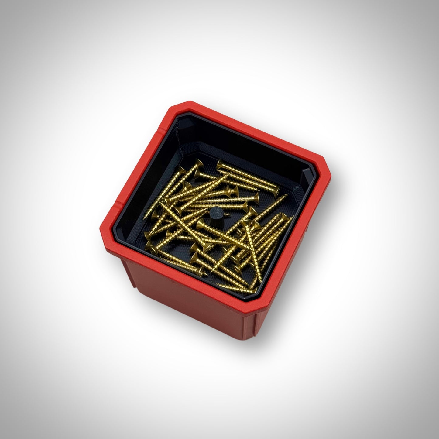 Milwaukee PACKOUT™ Medium Organiser with triple stack bin dividers installed, fully loaded with small parts and hardware neatly separated in each compartment.”
