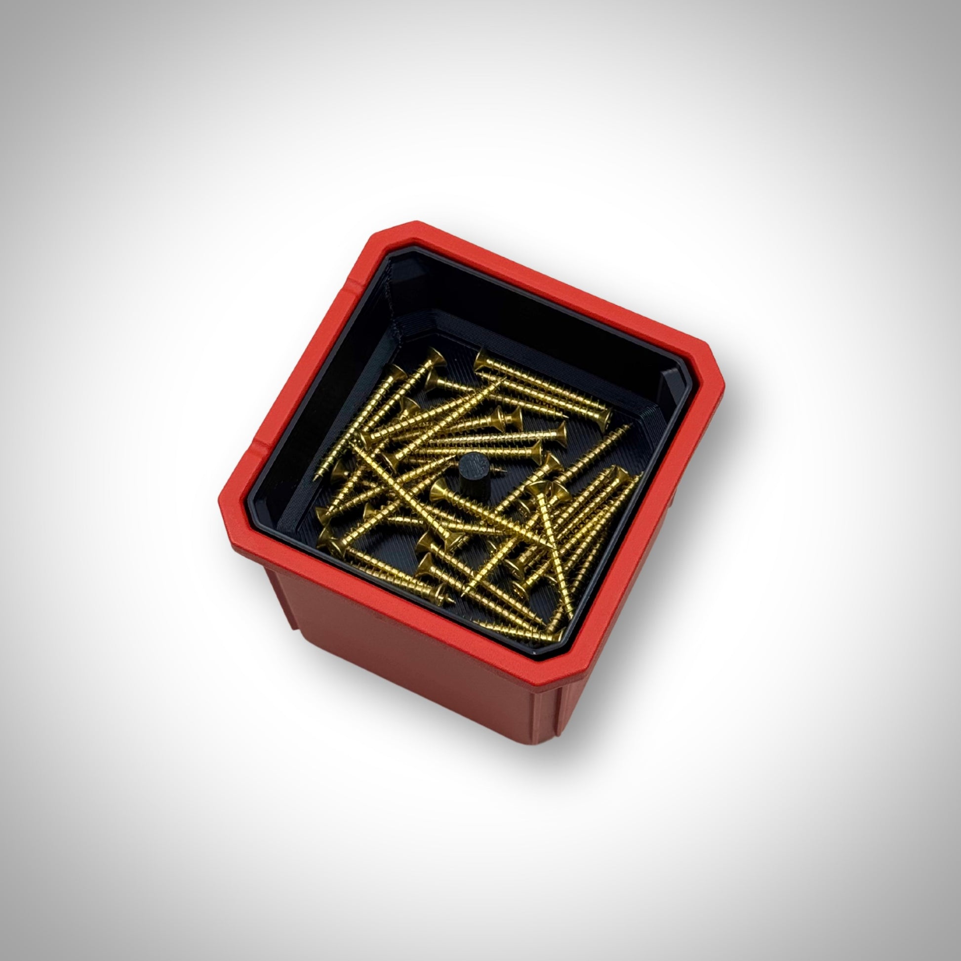 Milwaukee PACKOUT™ Medium Organiser with triple stack bin dividers installed, fully loaded with small parts and hardware neatly separated in each compartment.”