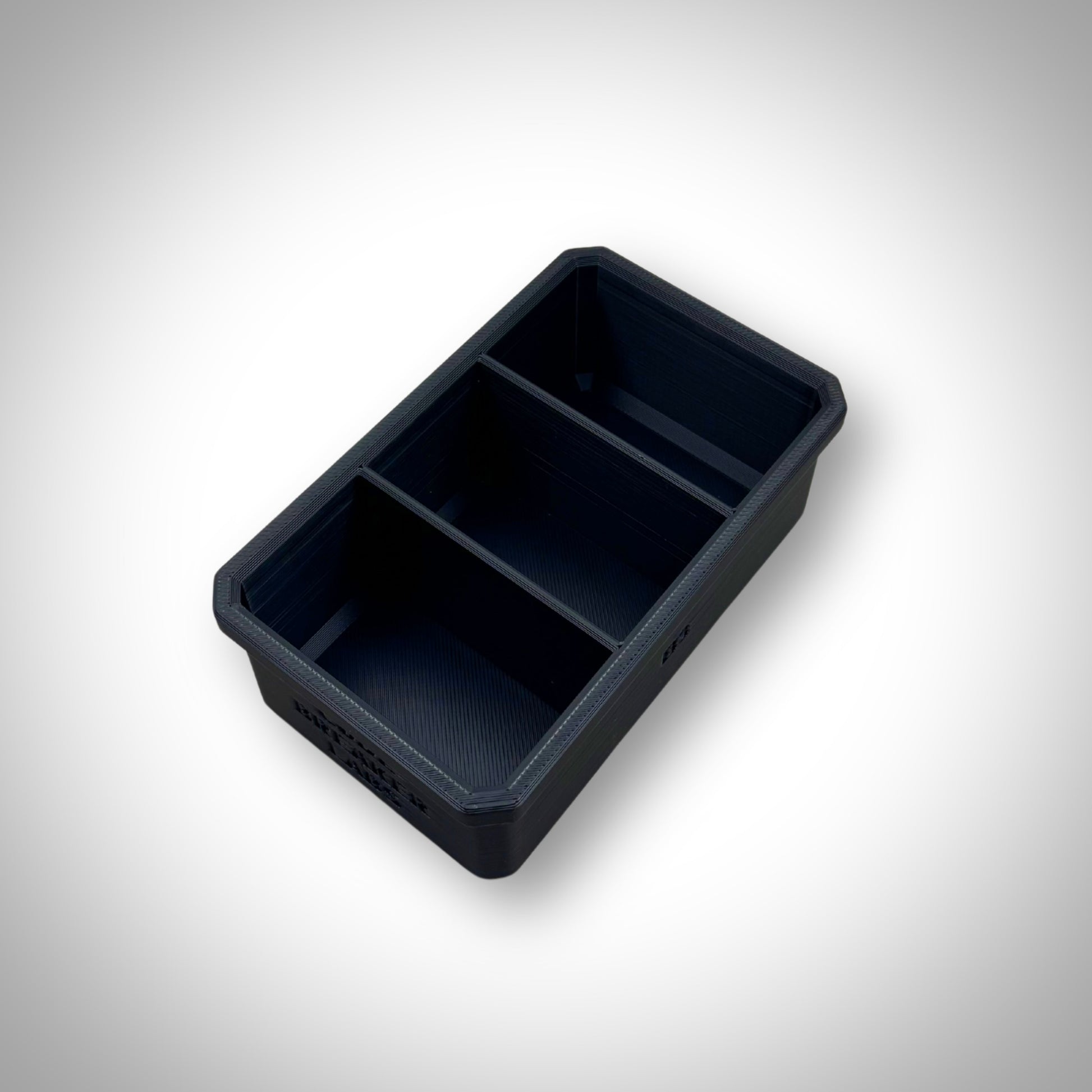 Empty Milwaukee PACKOUT™ 3-Way Divider Bin displayed outside the 4-Drawer Toolbox, showing its three compartments.