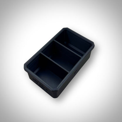 Empty Milwaukee PACKOUT™ 3-Way Divider Bin displayed outside the 4-Drawer Toolbox, showing its three compartments.