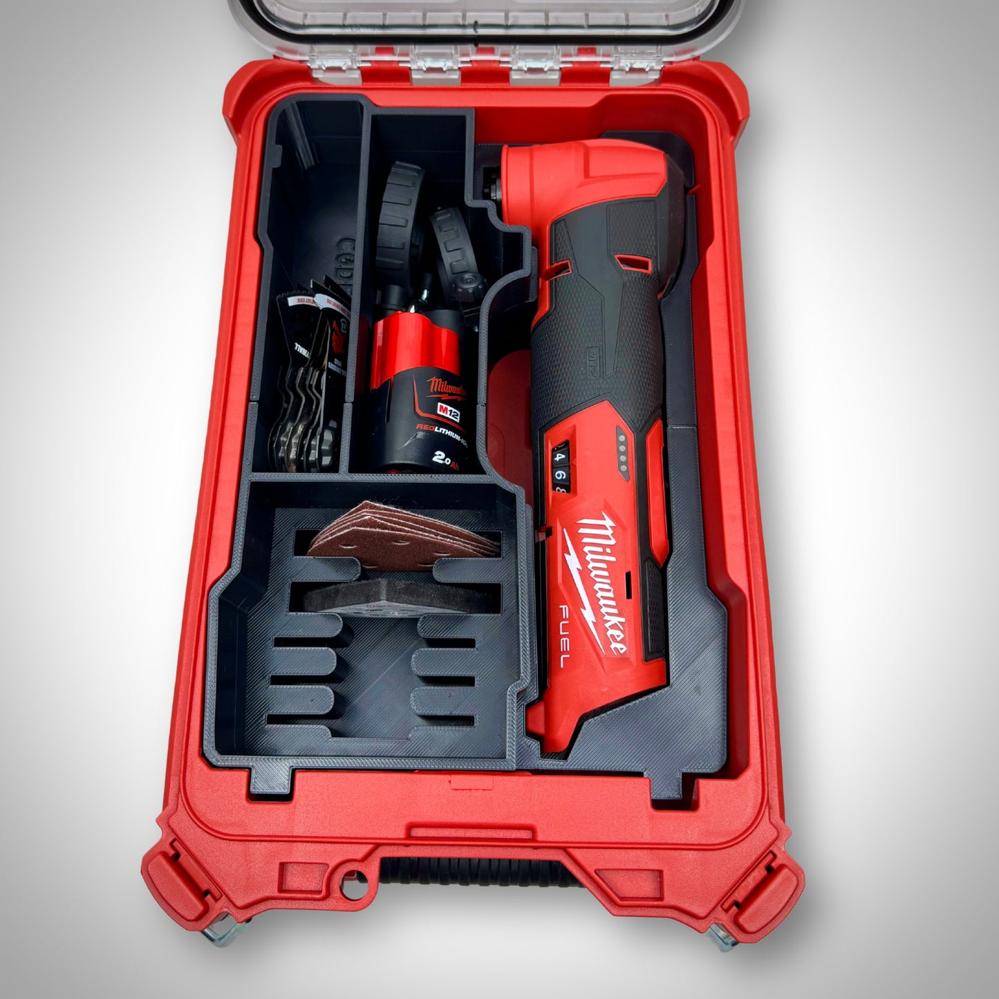 M12 FUEL Multi-Tool Insert loaded with the multi-tool, attachments, and batteries, neatly organized inside the Milwaukee PACKOUT™ Compact Organiser.