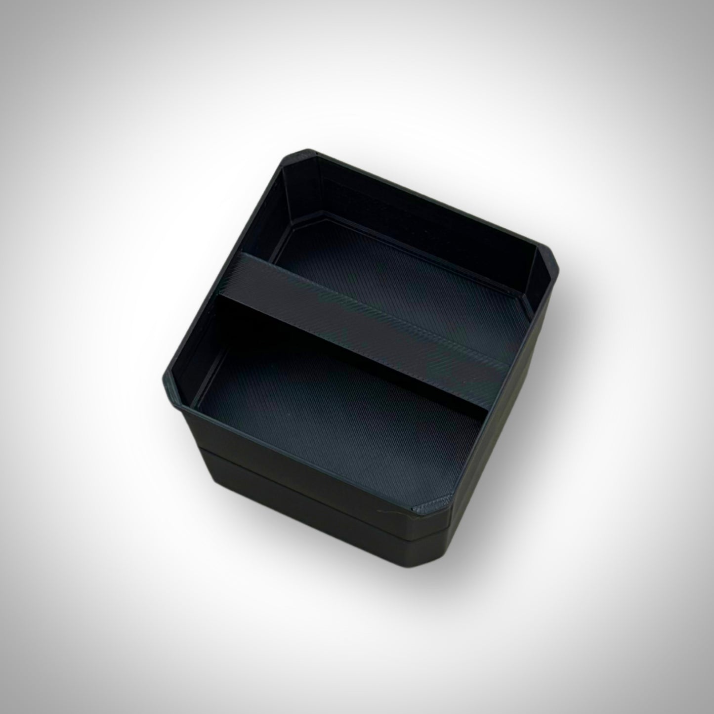 Double stack bin dividers shown outside the Milwaukee PACKOUT™ Medium Organiser, highlighting their sturdy build and modular stackable design.