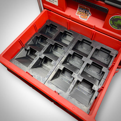 Two Empty M18 Battery Storage Insert seated inside the Milwaukee PACKOUT™ Two-Drawer Toolbox, showing custom-fit compartments ready for batteries.