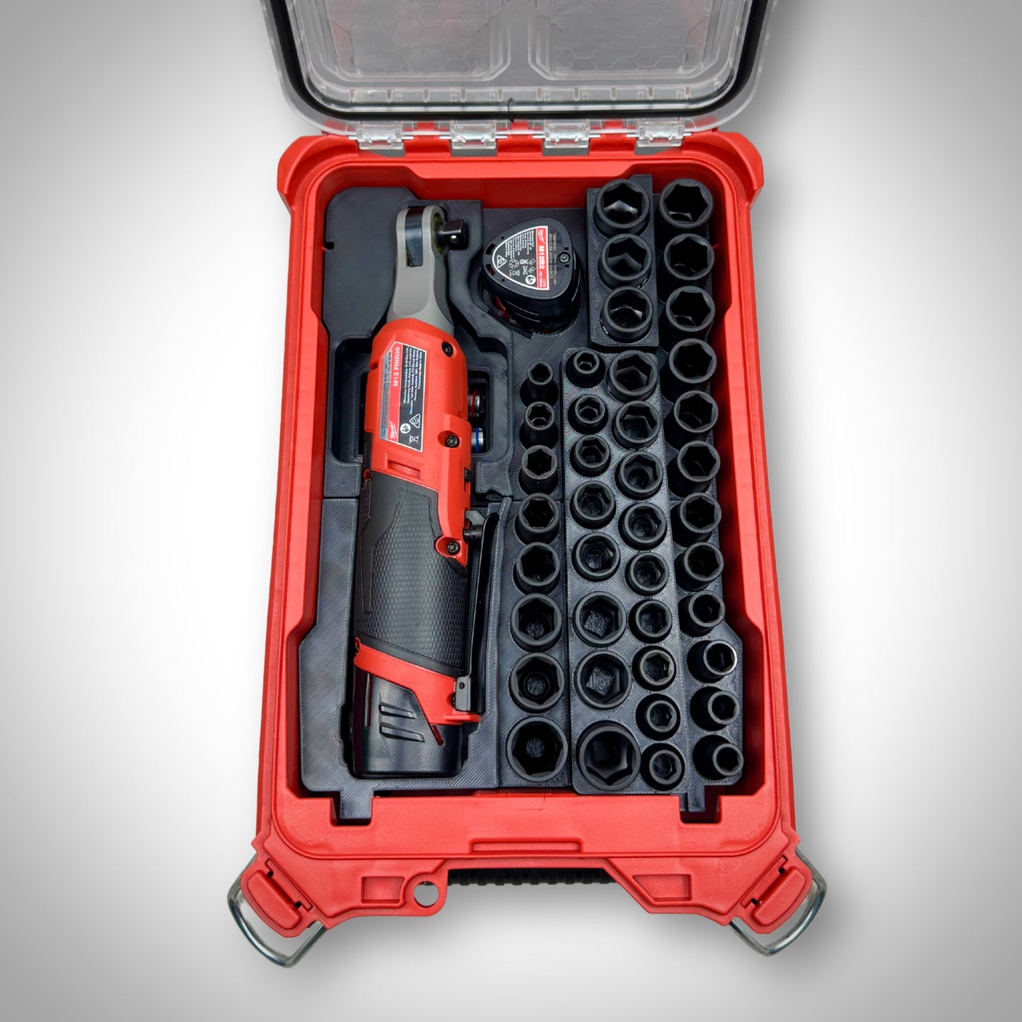 Milwaukee PACKOUT™ Compact Organiser with M12 Ratchet & 3/8" Socket Set Insert fully loaded with ratchet, sockets, and accessories, neatly organized inside the toolbox.