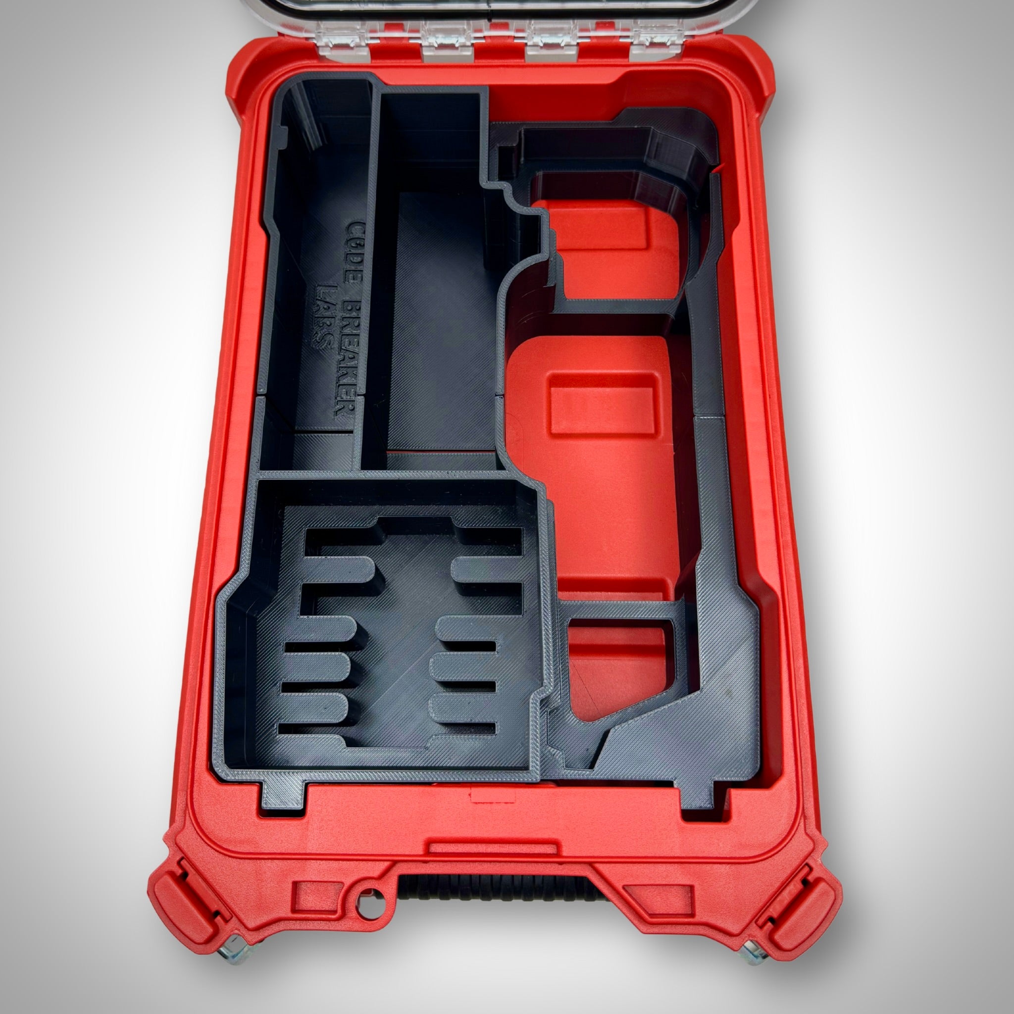 Empty M12 FUEL Multi-Tool Insert placed inside the PACKOUT™ Compact Organiser, showcasing the custom-molded compartments.