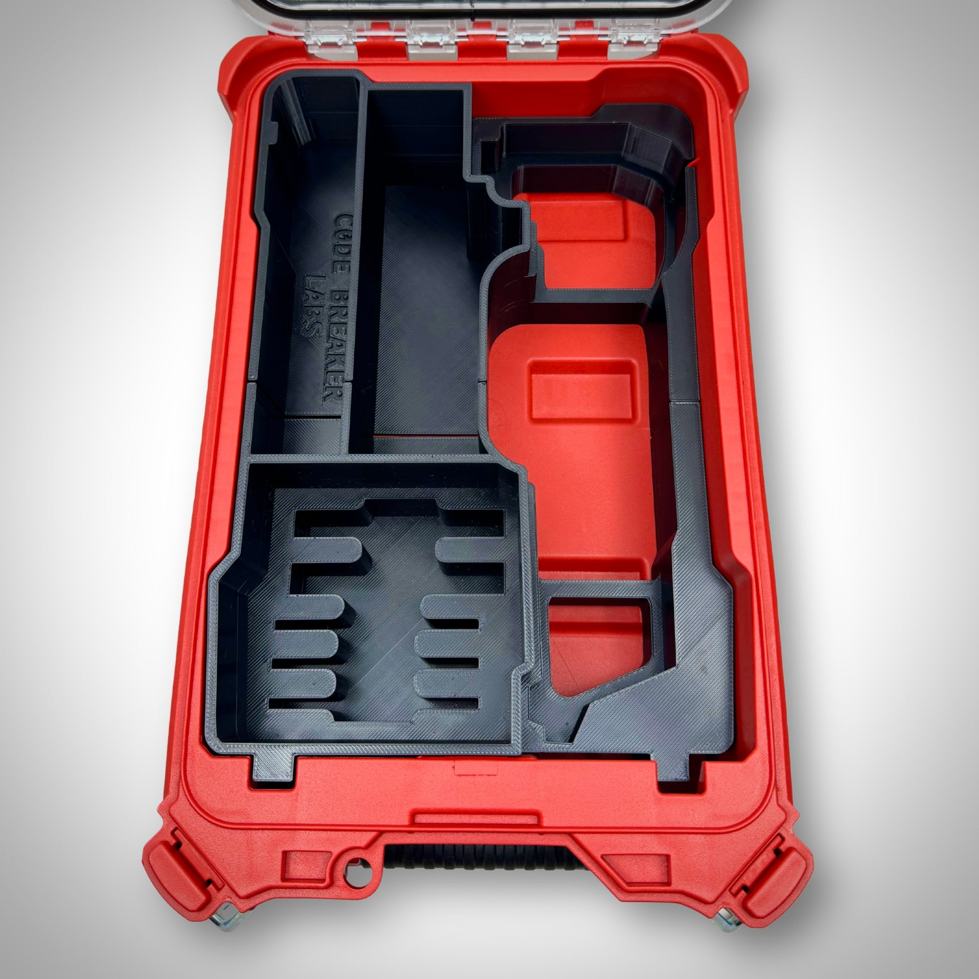 Empty M12 FUEL Multi-Tool Insert placed inside the PACKOUT™ Compact Organiser, showcasing the custom-molded compartments.