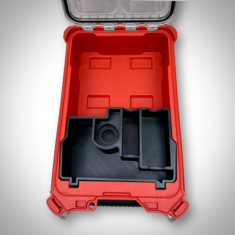 Empty Charging Kit Insert sitting in the PACKOUT™ Compact Organiser, displaying the designated compartments for charger and batteries.