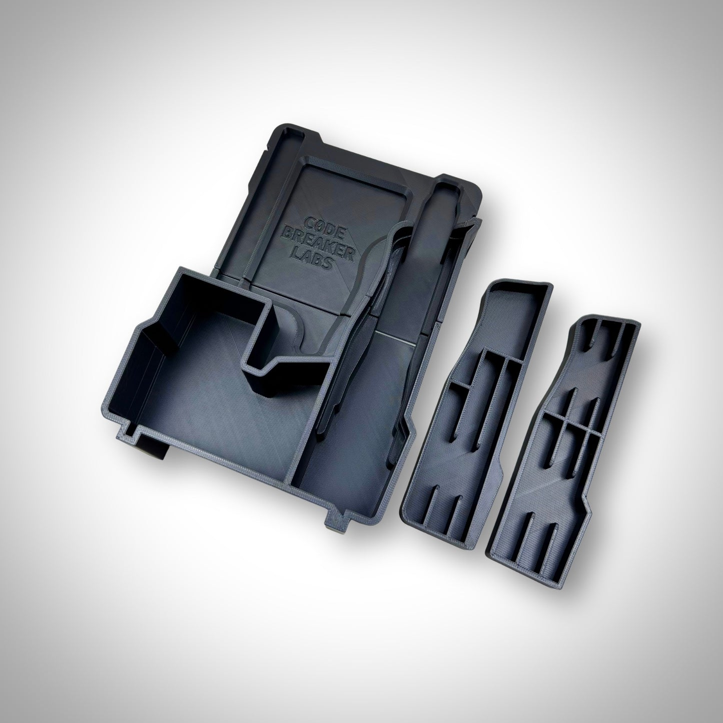 Empty custom insert for M12 FUEL Jigsaw shown outside of the Milwaukee PACKOUT Compact Organiser, highlighting compartment layout and precision fit.