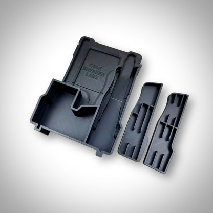 Empty custom insert for M12 FUEL Jigsaw shown outside of the Milwaukee PACKOUT Compact Organiser, highlighting compartment layout and precision fit.