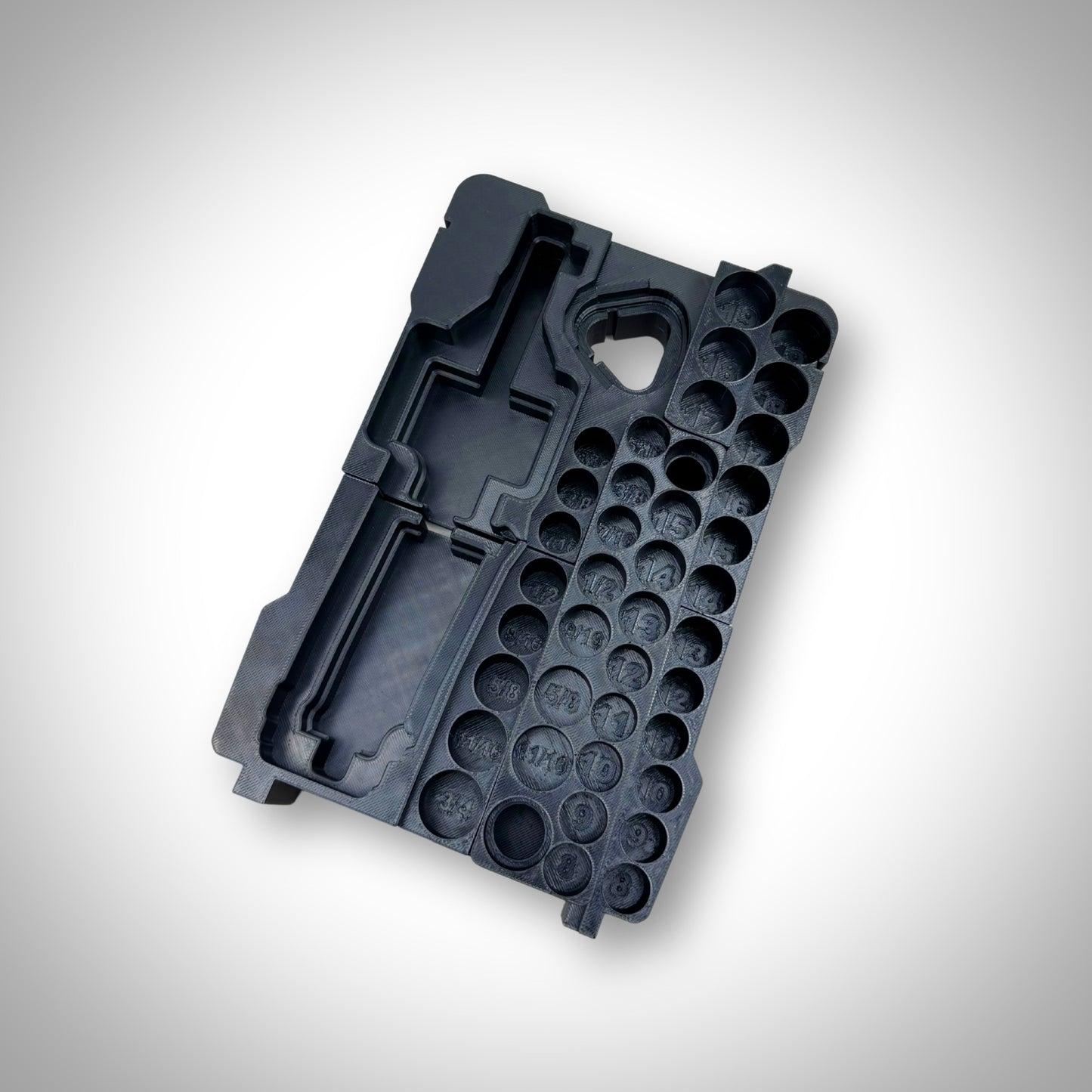 Empty M12 Ratchet & 3/8" Socket Set Insert displayed outside the Milwaukee PACKOUT™ Compact Organiser, highlighting its durable and custom-moulded compartments.