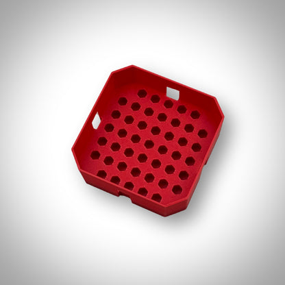 Red Milwaukee PACKOUT™ Low-Profile Bit Holder Insert displayed outside the PACKOUT™ bin, showcasing its compact and sturdy layout.