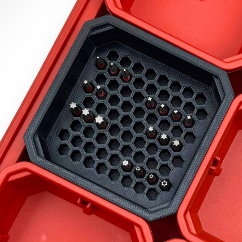 “Black Hex Bit Holder insert with a few 1-inch hex bits, organised neatly inside a Milwaukee PACKOUT™ bin.