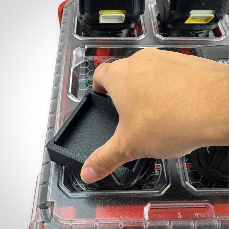 A hand showcasing the twist lock capability of the Makita 18V battery adaptor.
