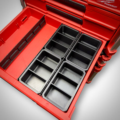 Four empty Milwaukee PACKOUT™ 3-Way Divider Bins neatly lined up inside the 4-Drawer Toolbox for organised hardware storage.