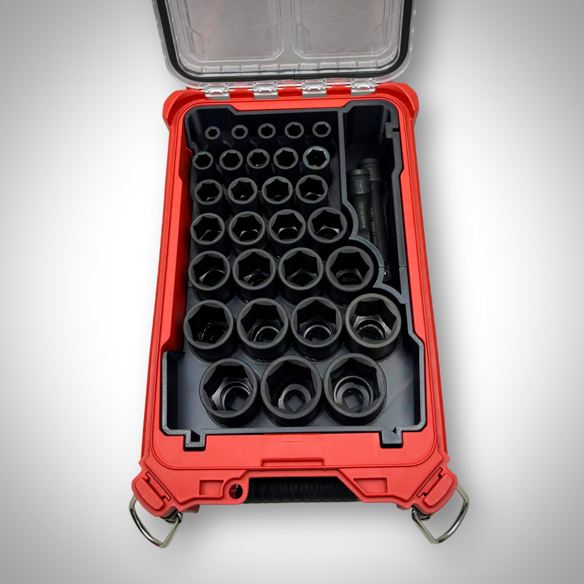 Metric socket organiser insert placed inside the Milwaukee PACKOUT Toolbox, fully loaded with sockets to showcase organised and accessible tool storage.