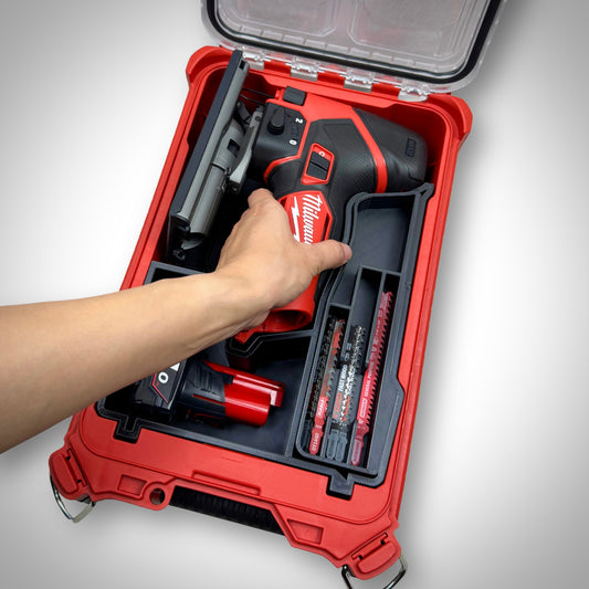 Milwaukee PACKOUT Compact Organiser with custom insert securely holding the M12 FUEL Jigsaw and accessories all neatly arranged inside the container, demonstrating the tool's ease of access.