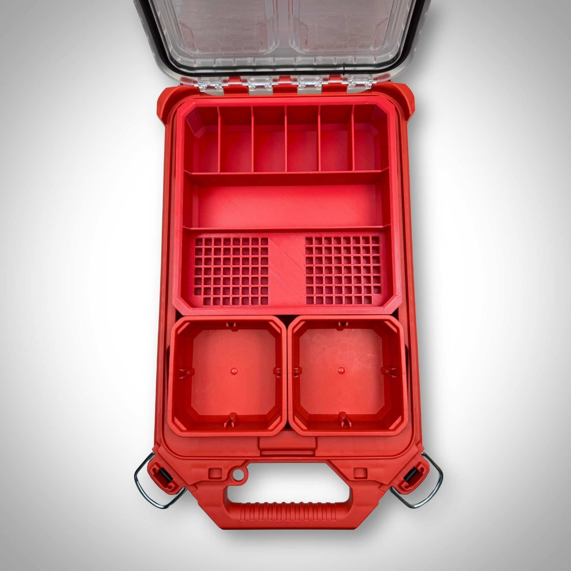 Empty red Impact Bit Holder V2 securely fitted inside the Milwaukee PACKOUT™ Low Profile Organiser, showcasing its custom-fit compartments ready for bits.