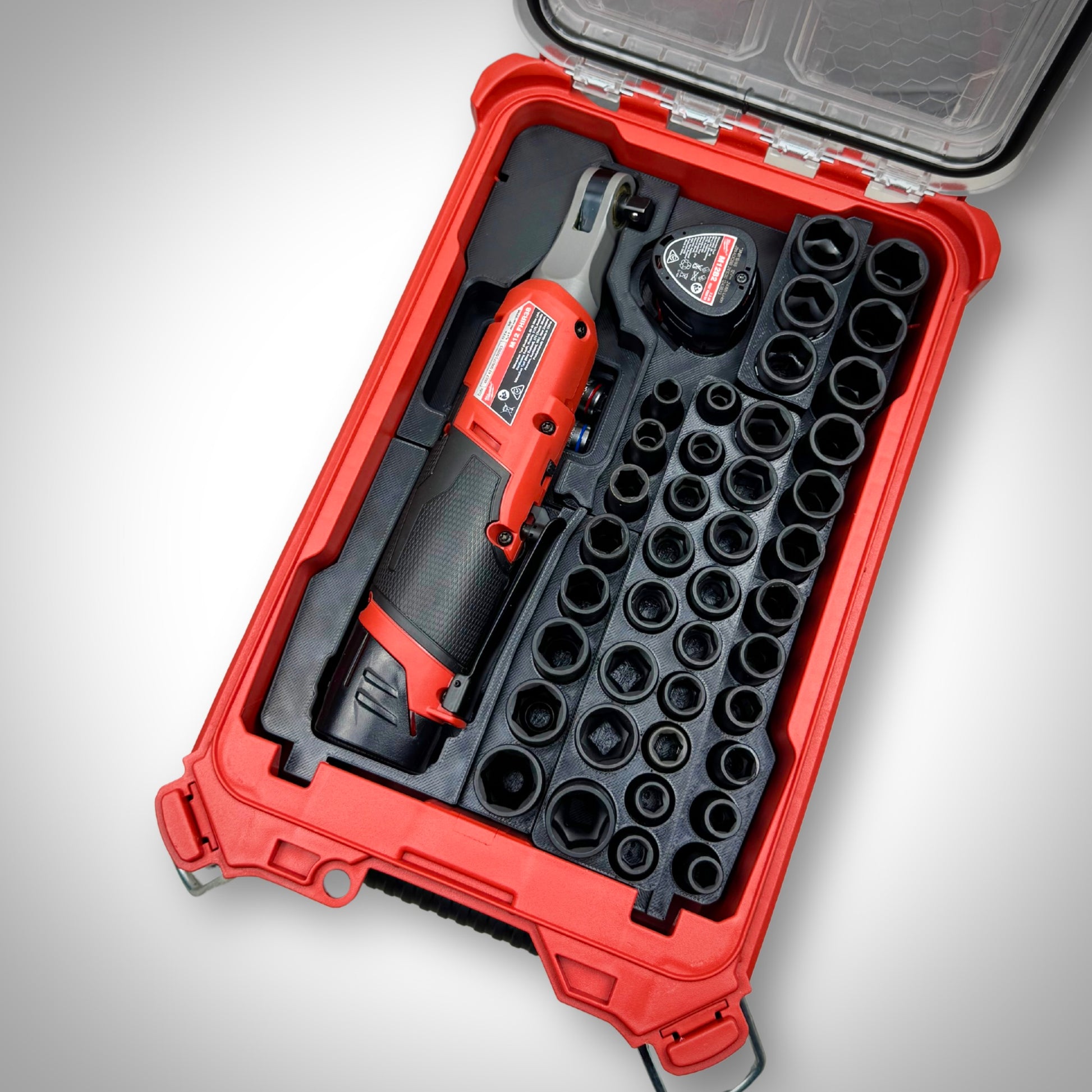 Milwaukee PACKOUT™ Compact Organiser with M12 Ratchet & 3/8" Socket Set Insert fully loaded with ratchet, sockets, and accessories, neatly organized inside the toolbox.