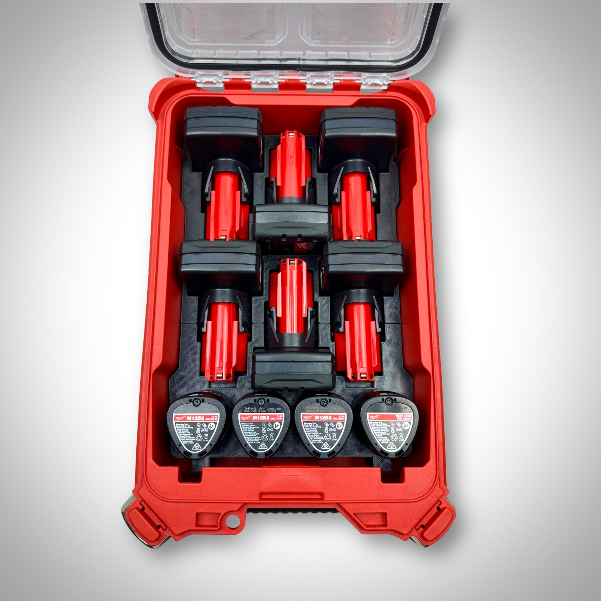 Milwaukee PACKOUT™ Compact Organiser with black M12 Battery Storage Insert fully loaded with M12 compact and extended batteries, neatly organised inside the toolbox.