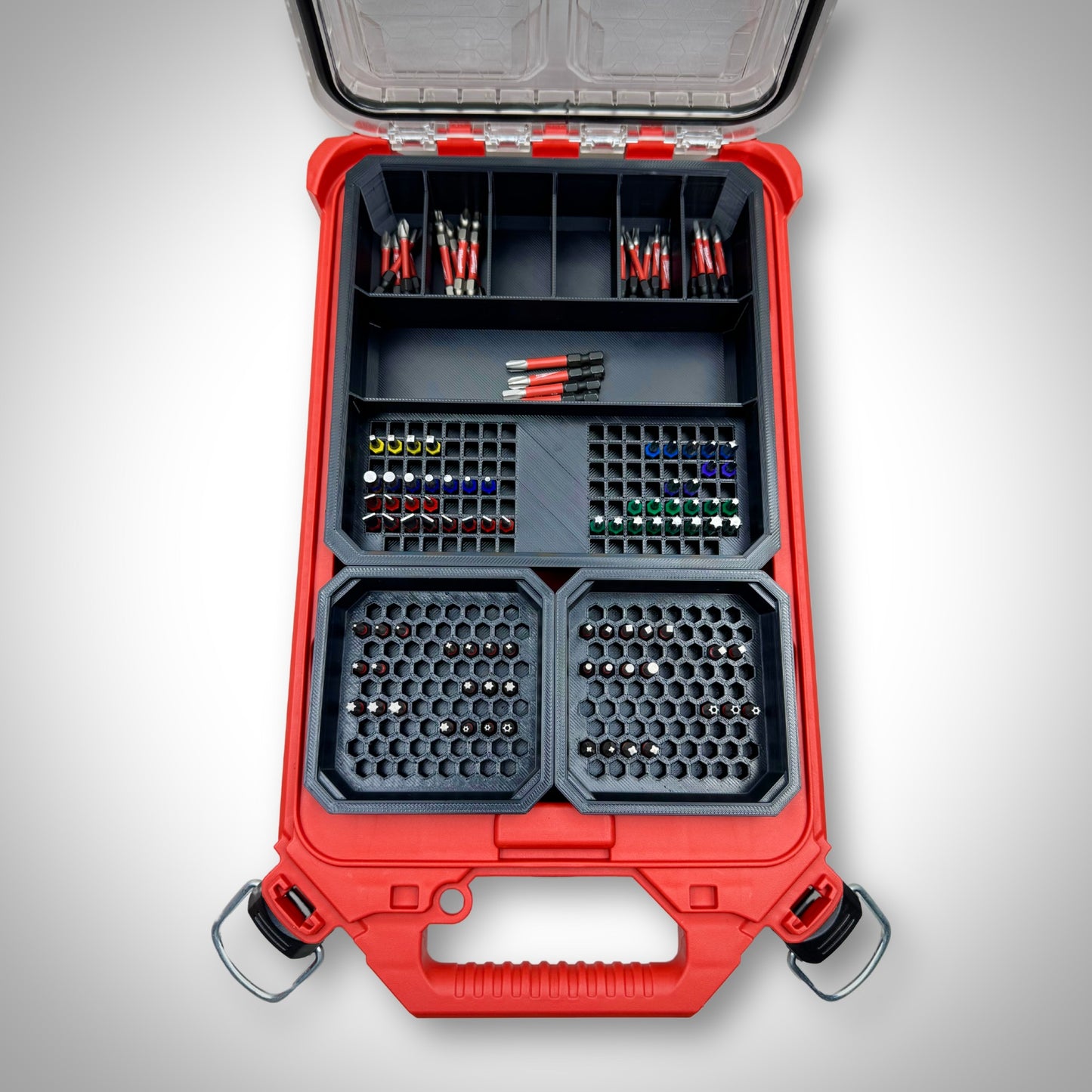 Milwaukee PACKOUT™ Low Profile Organiser loaded with the Impact Bit Organiser Combo insert, holding an assortment of 25mm, 50mm, and extension bits neatly arranged in designated compartments.