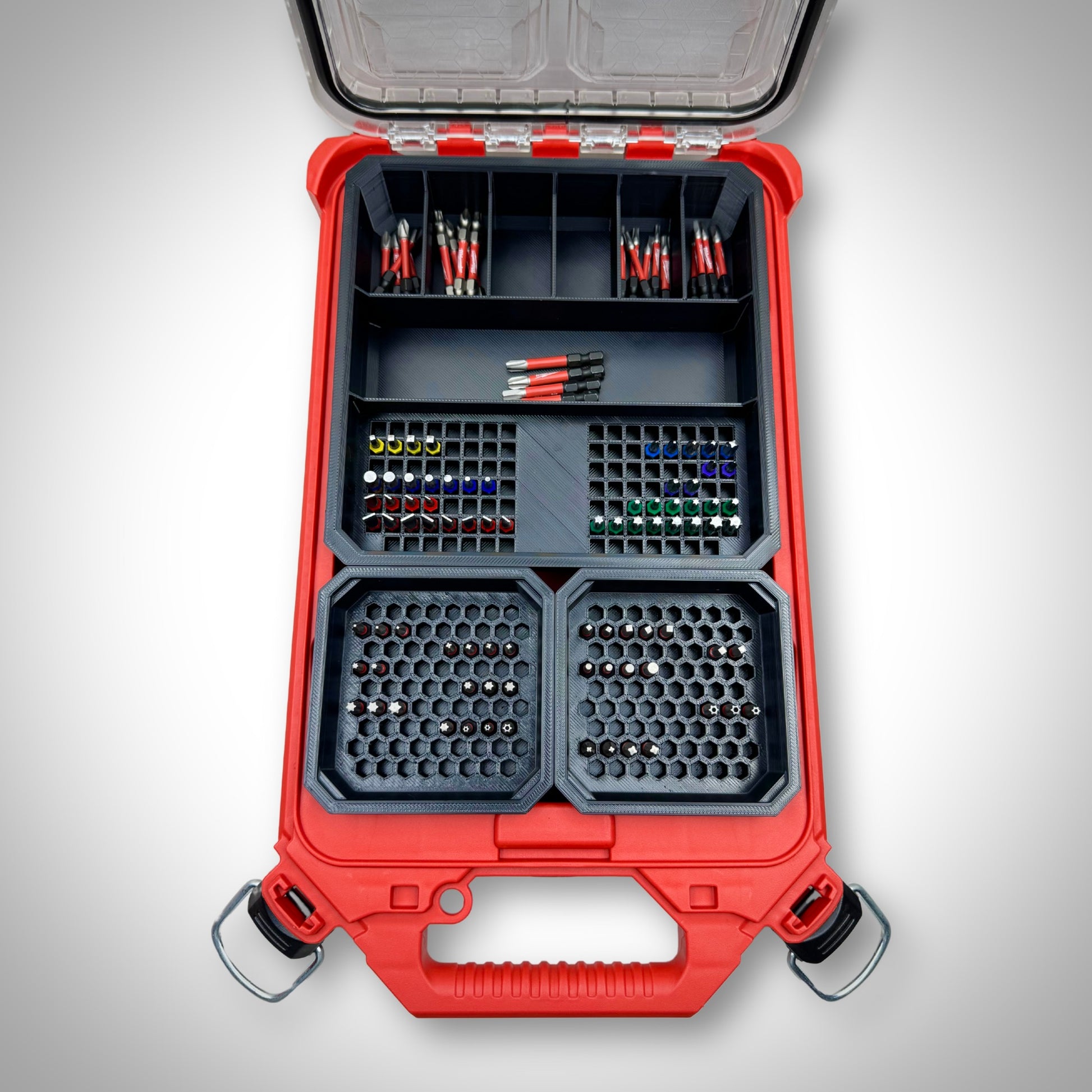 Milwaukee PACKOUT™ Low Profile Organiser loaded with the Impact Bit Organiser Combo insert, holding an assortment of 25mm, 50mm, and extension bits neatly arranged in designated compartments.