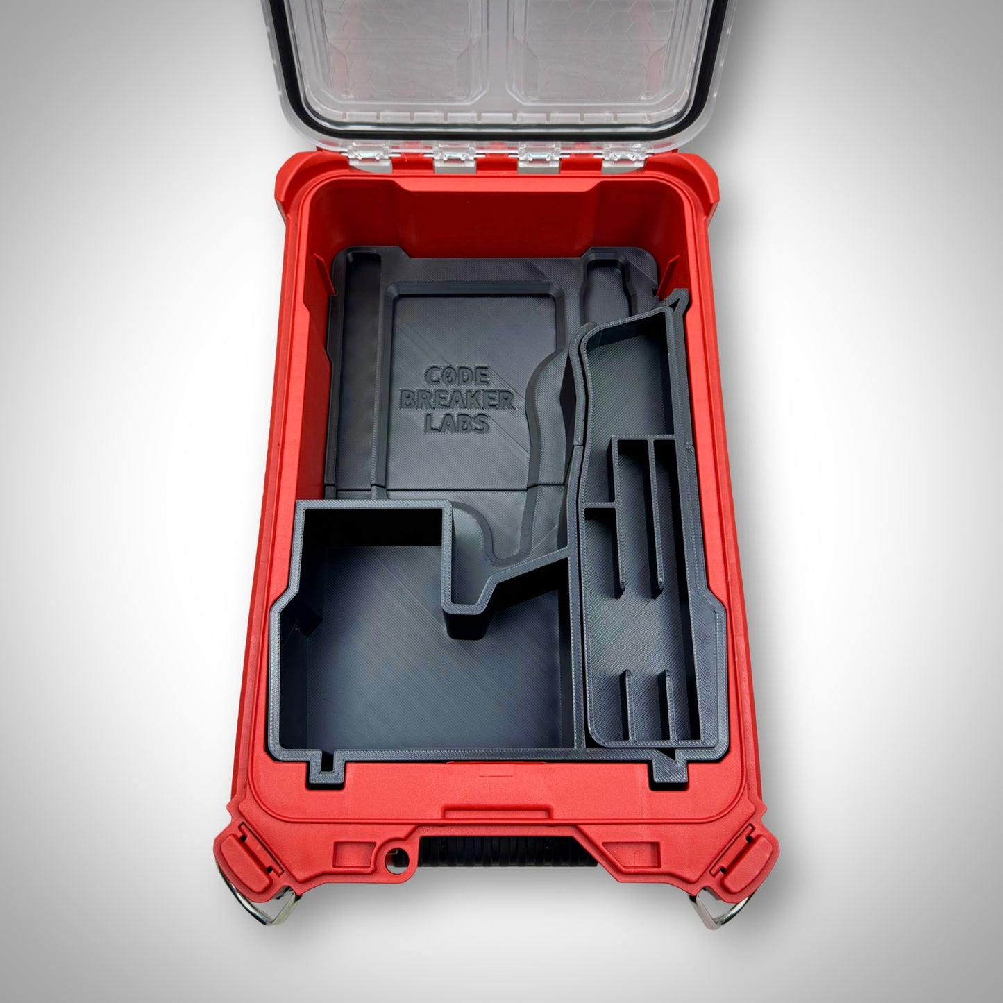 Empty custom insert for M12 FUEL Jigsaw shown inside of the Milwaukee PACKOUT Compact Organiser, highlighting compartment layout and precision fit.