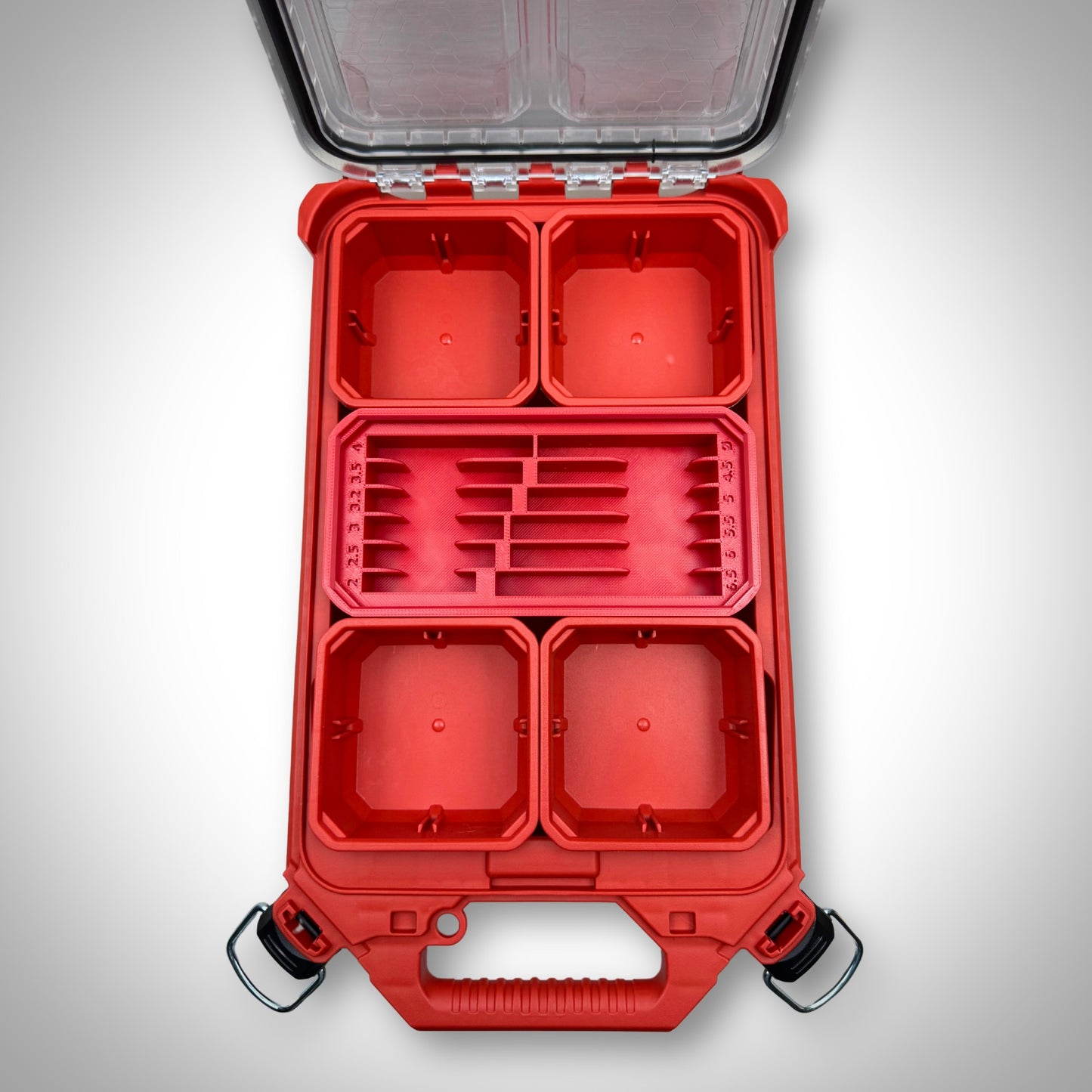 Empty red Metric Drill Bit Holder Insert snugly fitted inside the Milwaukee PACKOUT™ Low Profile Organiser, showing its custom compartments ready for drill bits.