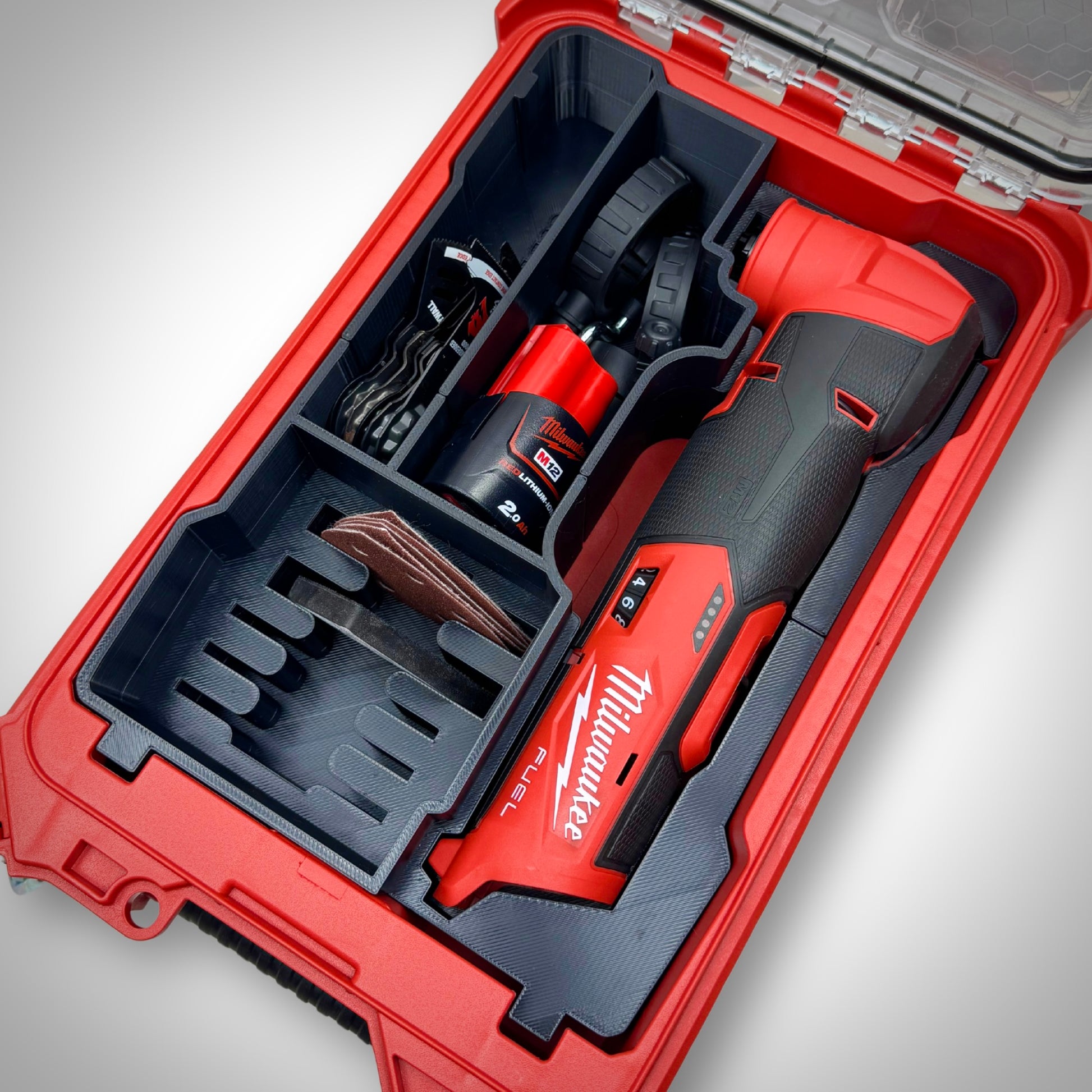M12 FUEL Multi-Tool Insert loaded with the multi-tool, attachments, and batteries, neatly organized inside the Milwaukee PACKOUT™ Compact Organiser.
