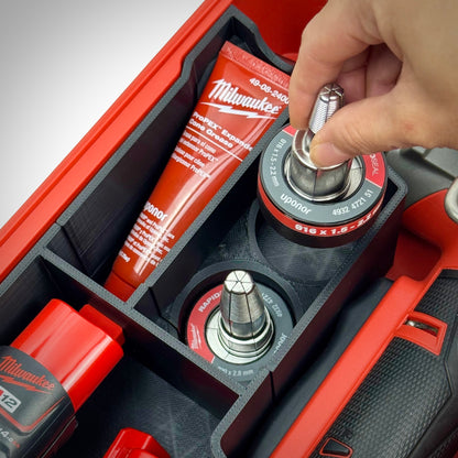 Hand lifting an accessory out of the insert, showing intuitive layout and convenient access to attachments.
