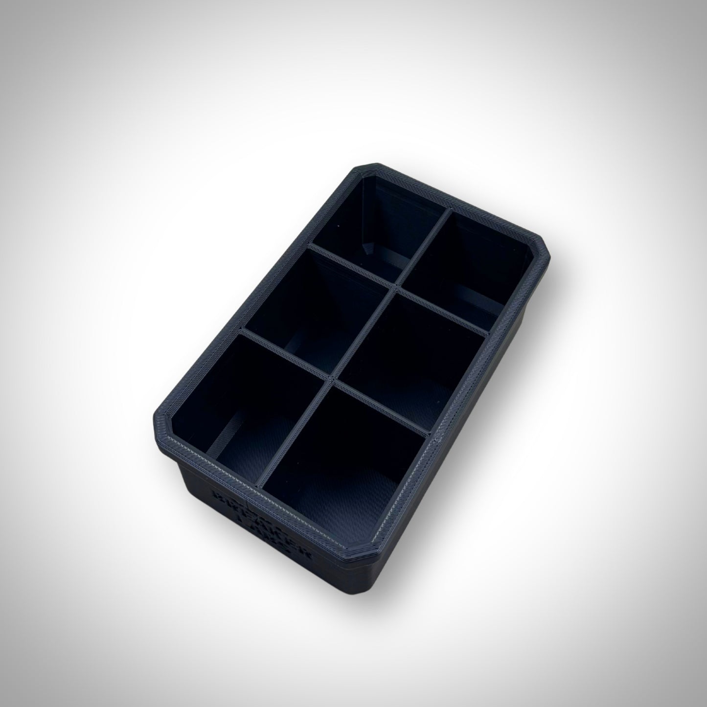 Empty Milwaukee PACKOUT™ 6-Way Divider Bin displayed outside the 4-Drawer Toolbox, showing six compartments for small items.
