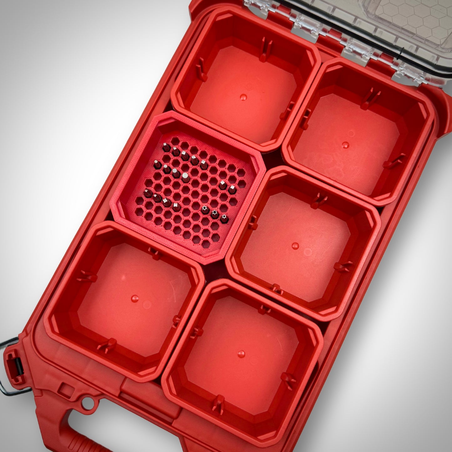 Red Hex Bit Holder insert fully loaded with a few 1-inch hex bits, neatly organised inside a Milwaukee PACKOUT™ bin