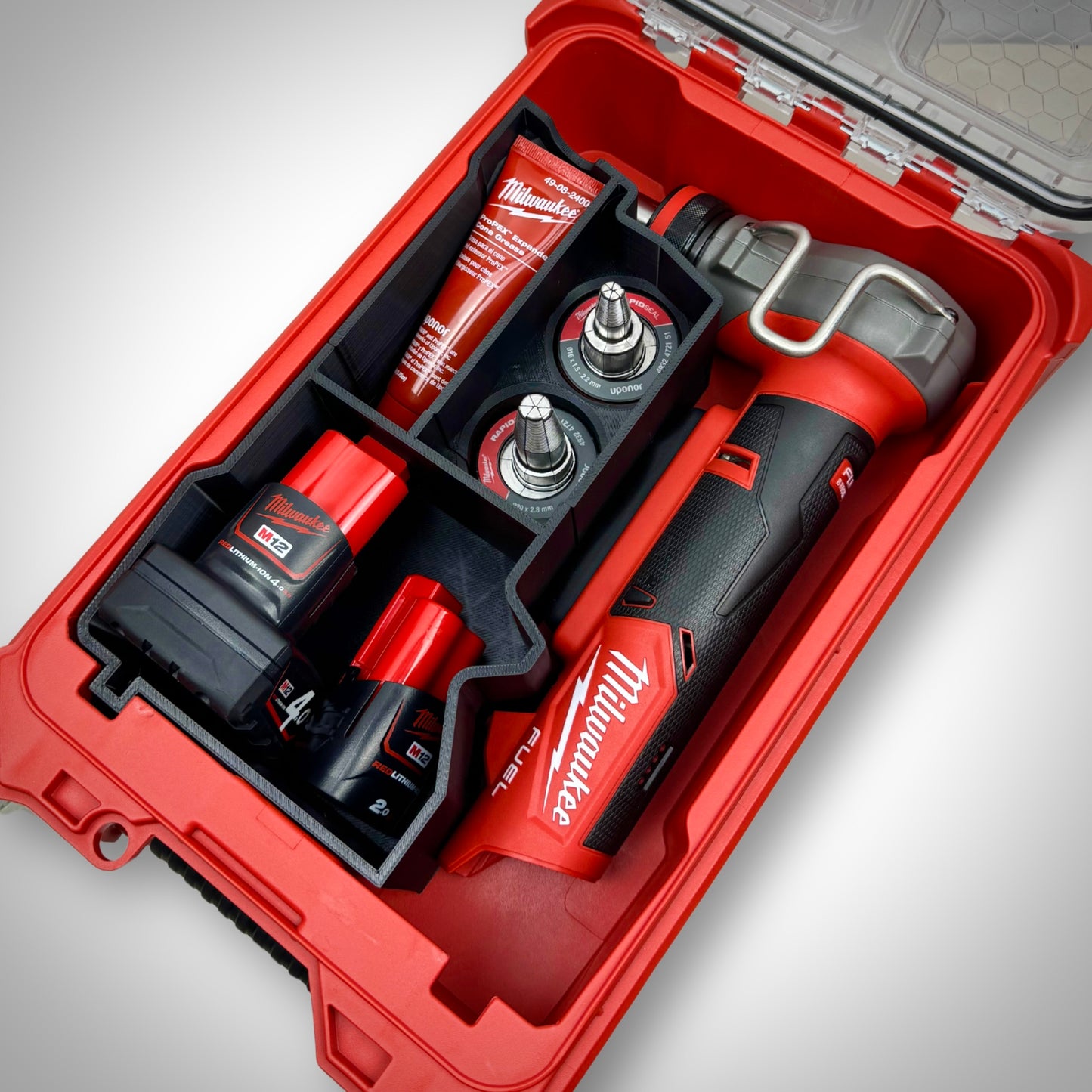 M12 Expansion Tool and all compatible heads and accessories securely stored in the insert inside the Milwaukee PACKOUT™ Compact Organiser.