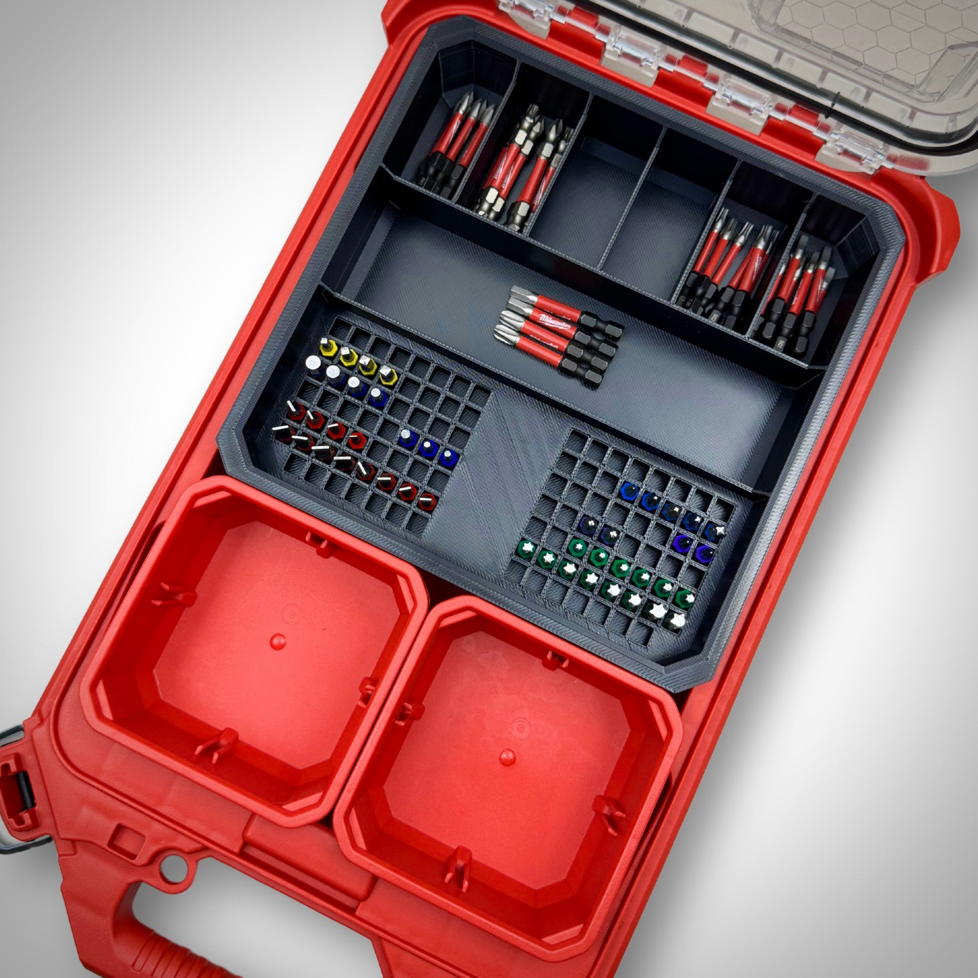 Milwaukee PACKOUT™ Low Profile Organiser featuring the Impact Bit Holder V2 fully loaded with 50mm bits and extension bits, neatly arranged inside the toolbox.