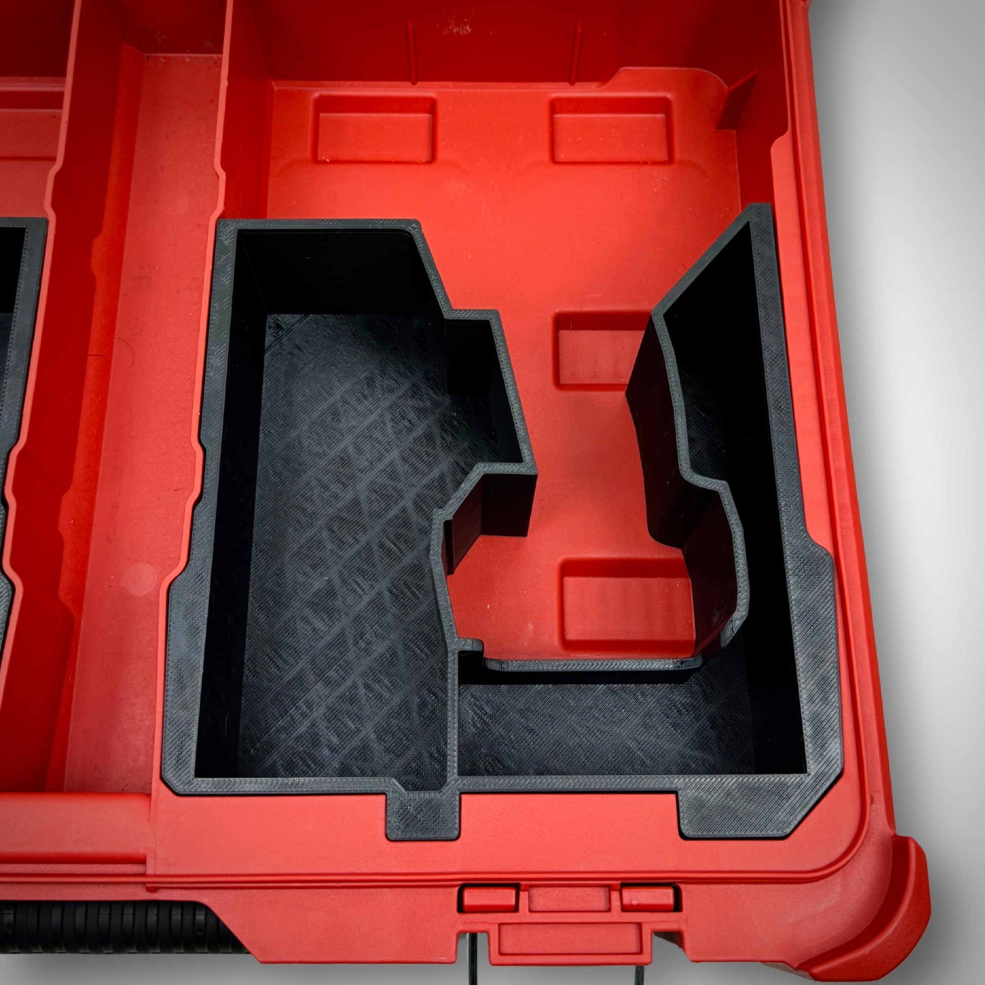 Empty insert placed inside the PACKOUT™ Organiser 48228430, highlighting the structured layout for tool and battery storage.
