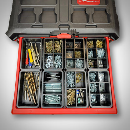 Milwaukee PACKOUT™ 4-Drawer Toolbox loaded with mixed divider bins loaded with different accessories.