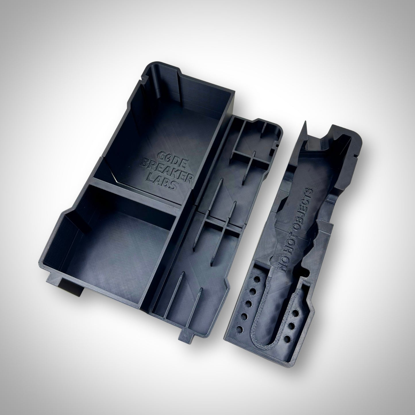 M12 Soldering Iron Insert displayed outside the PACKOUT™ Compact Organiser, highlighting durable, heat-resistant construction and compartment layout.