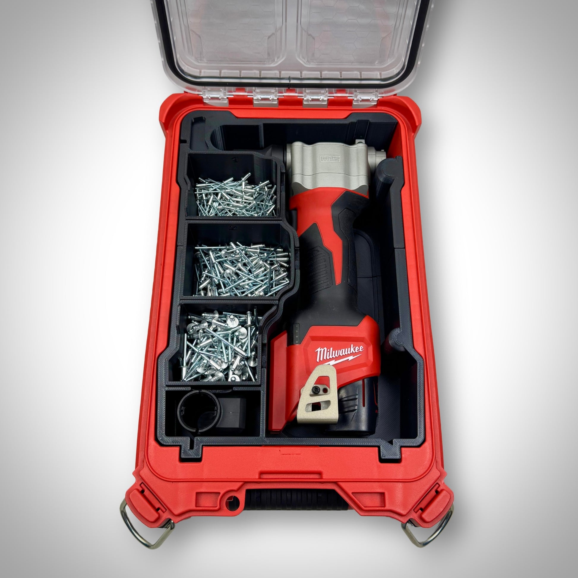 Milwaukee PACKOUT insert fully loaded with a ratchet, bolts, and small parts containers—demonstrating a complete, ready-to-use setup for efficient on-site organisation.