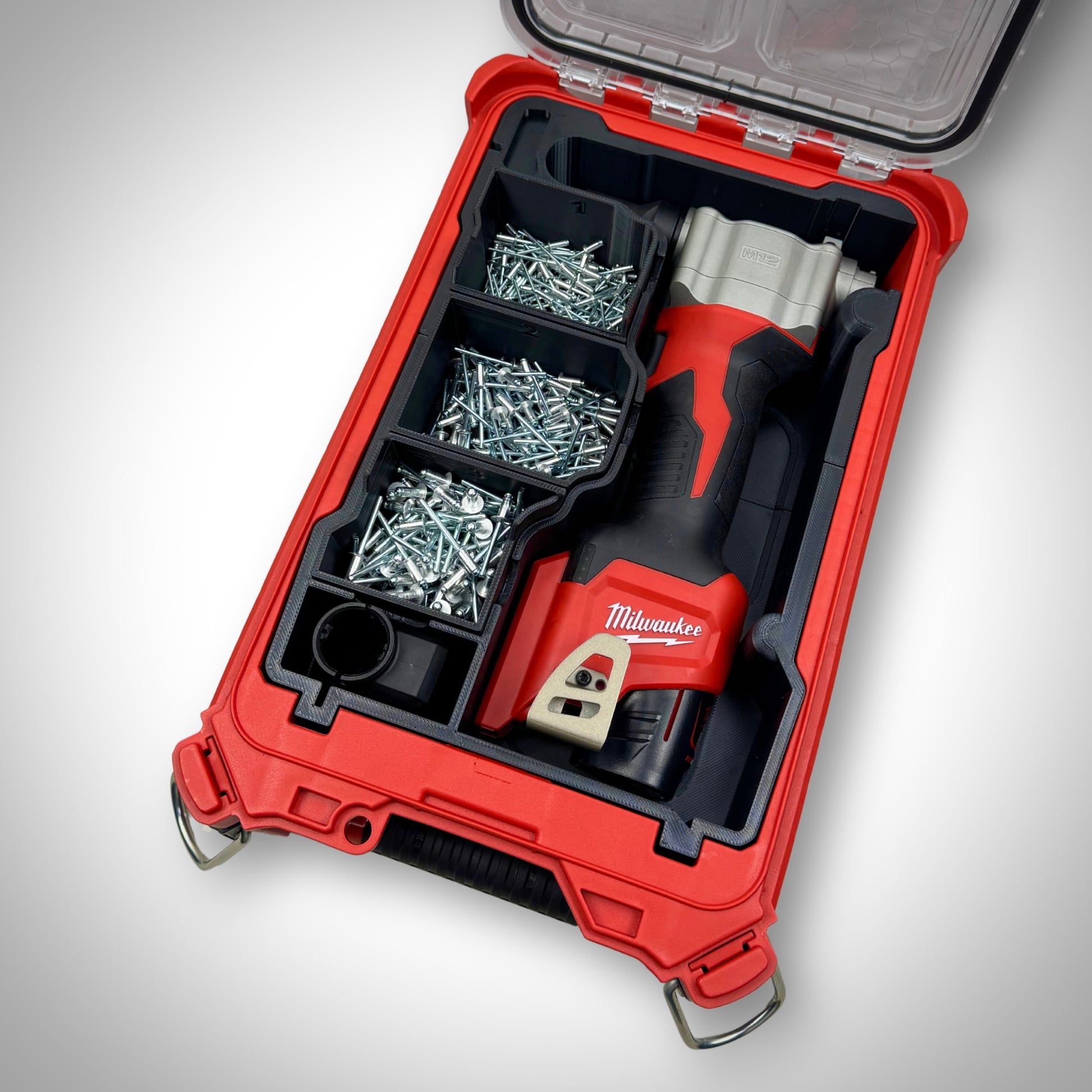Milwaukee PACKOUT insert fully loaded with a ratchet, bolts, and small parts containers—demonstrating a complete, ready-to-use setup for efficient on-site organisation.