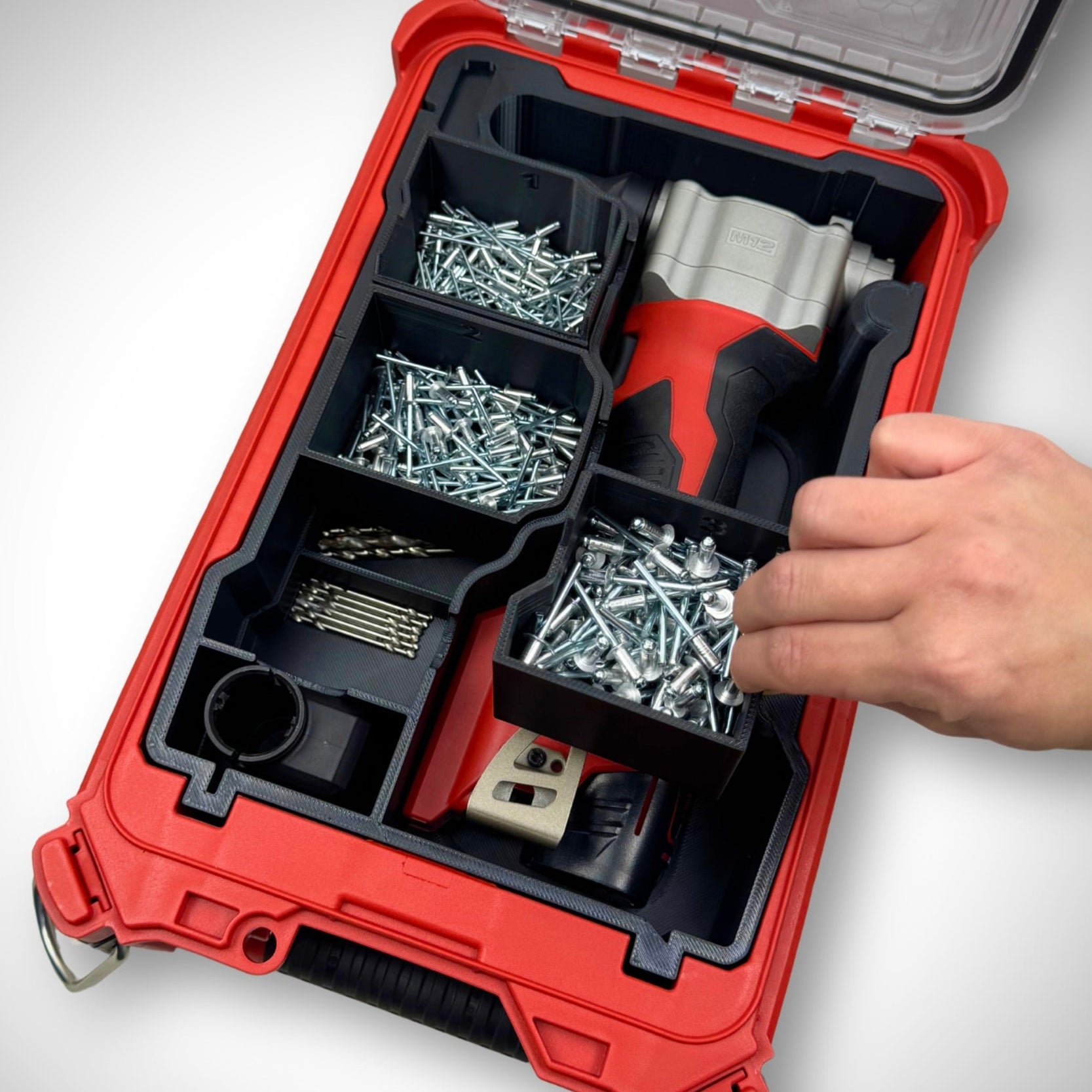 Empty Milwaukee PACKOUT insert for ratchet storage—showcasing the removable compartments and storage underneath.